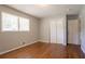 Bedroom with hardwood floors and a double closet and window at 802 San Miguel Dr, Stone Mountain, GA 30083