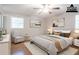 Virtually staged bedroom with hardwood floors and a comfortable bed at 802 San Miguel Dr, Stone Mountain, GA 30083