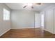 Bedroom featuring hardwood floors, light walls, ceiling fan, and plenty of natural light at 802 San Miguel Dr, Stone Mountain, GA 30083