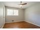 Cozy bedroom with hardwood floors, ceiling fan, and natural light from the double-paned window at 802 San Miguel Dr, Stone Mountain, GA 30083