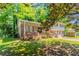 Front exterior view of a split-level house with a brick porch and an attached garage at 802 San Miguel Dr, Stone Mountain, GA 30083