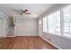 A bright living room featuring hardwood floors, large windows, and a staircase at 802 San Miguel Dr, Stone Mountain, GA 30083