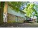 Back of house features brick and siding, plus a small deck at 802 San Miguel Dr, Stone Mountain, GA 30083