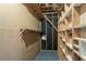 Unfinished storage room with shelving and pegboard walls at 802 San Miguel Dr, Stone Mountain, GA 30083