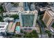 Stunning aerial view highlighting the building's architecture, rooftop pool, and urban surroundings at 3324 Peachtree Ne Rd # 1304, Atlanta, GA 30326