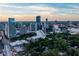 Beautiful aerial view of city skyline with modern architecture and mature green trees at 3324 Peachtree Ne Rd # 1304, Atlanta, GA 30326