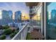 Balcony view with sunset, showcasing a city skyline, and outdoor seating for relaxation at 3324 Peachtree Ne Rd # 1304, Atlanta, GA 30326