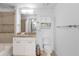 Clean bathroom includes tiled shower-tub combo, granite vanity, and matching cabinets at 3324 Peachtree Ne Rd # 1304, Atlanta, GA 30326