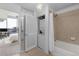 Ensuite bathroom features a shower-tub combination, in-unit laundry and bedroom access at 3324 Peachtree Ne Rd # 1304, Atlanta, GA 30326