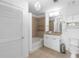 Bathroom featuring a shower-tub combo with tiled walls and granite countertop vanity at 3324 Peachtree Ne Rd # 1304, Atlanta, GA 30326