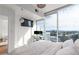 Bright bedroom features a large window with city views and a convenient work space at 3324 Peachtree Ne Rd # 1304, Atlanta, GA 30326