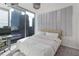 Bedroom with upholstered headboard, city views, and a dedicated desk area at 3324 Peachtree Ne Rd # 1304, Atlanta, GA 30326