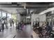 Well-equipped gym featuring multiple exercise machines and large windows for ample natural light at 3324 Peachtree Ne Rd # 1304, Atlanta, GA 30326