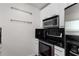 Modern kitchen featuring stainless steel appliances and black subway tile backsplash at 3324 Peachtree Ne Rd # 1304, Atlanta, GA 30326