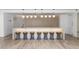 Modern kitchen area with sleek countertops, stylish bar stools, and contemporary pendant lighting, ideal for entertaining at 3324 Peachtree Ne Rd # 1304, Atlanta, GA 30326
