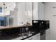 Kitchen featuring stainless appliances, granite countertops and black backsplash at 3324 Peachtree Ne Rd # 1304, Atlanta, GA 30326