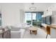 Bright living room with skyline views, modern furniture and a unique lighting fixture at 3324 Peachtree Ne Rd # 1304, Atlanta, GA 30326