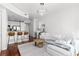 Bright living room with modern lighting, breakfast bar, and a large sectional sofa at 3324 Peachtree Ne Rd # 1304, Atlanta, GA 30326