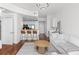 Bright living room with modern lighting, breakfast bar, and a large sectional sofa at 3324 Peachtree Ne Rd # 1304, Atlanta, GA 30326