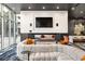 Comfortable lounge area with plush seating, a large TV, and contemporary design elements at 3324 Peachtree Ne Rd # 1304, Atlanta, GA 30326