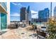 Luxury rooftop terrace features a stainless steel grill, outdoor dining area, and views of surrounding skyscrapers at 3324 Peachtree Ne Rd # 1304, Atlanta, GA 30326