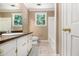 Bathroom featuring vanity, toilet, bathtub and window providing natural light at 4981 Forestglade Ct, Stone Mountain, GA 30087