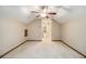Empty bedroom featuring a ceiling fan, window, and closet at 4981 Forestglade Ct, Stone Mountain, GA 30087