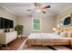Tranquil bedroom featuring soft lighting and a stylish ceiling fan at 4981 Forestglade Ct, Stone Mountain, GA 30087