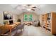 Staged bedroom featuring a desk, bookshelves, chair, and window at 4981 Forestglade Ct, Stone Mountain, GA 30087