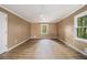 Spacious bedroom with hardwood floors, neutral walls, and natural light at 4981 Forestglade Ct, Stone Mountain, GA 30087