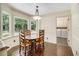 Charming breakfast nook features large windows and a classic chandelier at 4981 Forestglade Ct, Stone Mountain, GA 30087
