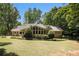 Inviting brick home with lush landscaping, showcasing a serene and picturesque curb appeal at 4981 Forestglade Ct, Stone Mountain, GA 30087