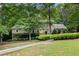Beautiful brick home with a well-manicured lawn and established landscaping, offering inviting curb appeal at 4981 Forestglade Ct, Stone Mountain, GA 30087