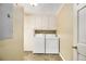 Convenient laundry room with washer, dryer, and ample storage space at 4981 Forestglade Ct, Stone Mountain, GA 30087