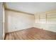 Home office featuring built-in cabinets and hardwood flooring at 4981 Forestglade Ct, Stone Mountain, GA 30087