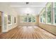 Bright sunroom featuring an airy feel with lots of natural light and hardwood floors at 4981 Forestglade Ct, Stone Mountain, GA 30087
