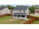 Fenced backyard with a screened-in porch, offering a private outdoor living space and green lawn at 548 Azalea Bloom Drive E, Loganville, GA 30052