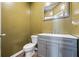 A half bathroom features gray cabinets and a new sink at 548 Azalea Bloom Drive E, Loganville, GA 30052