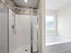 Modern bathroom featuring shower stall and separate soaking tub at 548 Azalea Bloom Drive E, Loganville, GA 30052