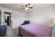 Cozy bedroom featuring a ceiling fan, soft carpet, and comfortable furnishings at 548 Azalea Bloom Drive E, Loganville, GA 30052