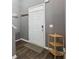Entryway with a modern door, hardwood floors, and stylish accents for a welcoming entrance at 548 Azalea Bloom Drive E, Loganville, GA 30052