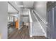Inviting entryway with hardwood floors, stairs, and neutral wall paint at 548 Azalea Bloom Drive E, Loganville, GA 30052