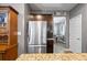 Well-lit kitchen showcasing granite countertops and stainless-steel refrigerator at 548 Azalea Bloom Drive E, Loganville, GA 30052