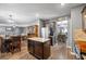 Open kitchen with hardwood floors, a granite island, and stainless steel appliances at 548 Azalea Bloom Drive E, Loganville, GA 30052