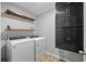 Functional laundry room with washer, dryer, and built-in cabinets at 548 Azalea Bloom Drive E, Loganville, GA 30052