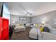 Large living room with hardwood floors, a corner sofa, and modern décor at 548 Azalea Bloom Drive E, Loganville, GA 30052