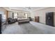 Large main bedroom with expansive layout and comfortable seating area at 548 Azalea Bloom Drive E, Loganville, GA 30052