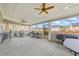 The covered patio features ceiling fans, ample space, and equipment, perfect for outdoor living at 548 Azalea Bloom Drive E, Loganville, GA 30052