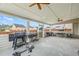 Covered patio with ceiling fans offers a versatile space for grilling, dining, and relaxation at 548 Azalea Bloom Drive E, Loganville, GA 30052