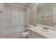 Bathroom with a shower and tub combo, tile accents, sink, and toilet at 1074 Cherokee Hts, Stone Mountain, GA 30083